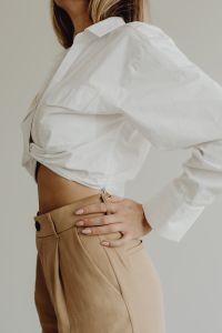 Minimal fashion - Faceless Aesthetic - Unrecognizable Woman in beige trousers