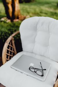 Outdoor office with laptop and glasses