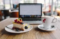 Working in a restaurant: Macbook, Cheese Cake and Cup of Coffee