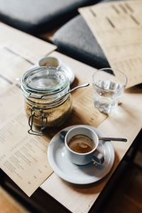 Kaboompics - Morning coffee with a jar of brown sugar and a glass of water
