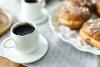 A cup of Coffee with Homemade Donuts