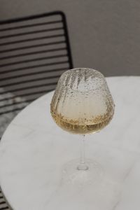Kaboompics - White Marble Table with a Glass of White Wine