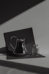 Kaboompics - Refined Aromas: Perfume Bottles Cast in Shadows and Light