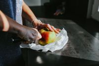 Woman cutting an apple
