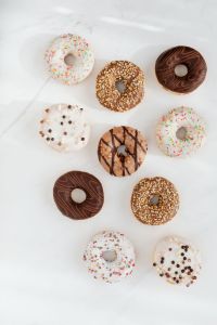 Various donuts on white marble