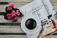Little pink flowers with a coffee and a magazine