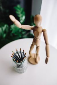 Wooden mannequin in various poses