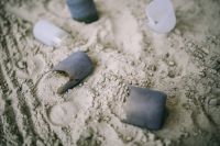 Kaboompics - Broken bottles in sand