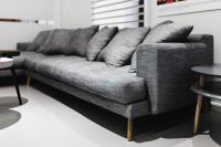 Grey long sofa with pillows