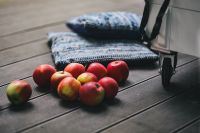 Red apples on a wooden floor