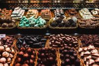 Sweets store at Boqueria market place in Barcelona, Spain. Assorted chocolate candy shop.