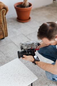 Kaboompics - Filmmaker with DSLR Camera Taking Shoots