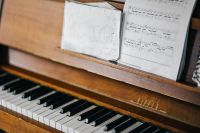Old piano with sheet music