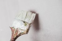 Paintbrush covered with paint