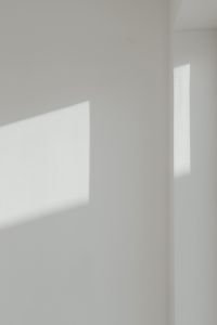 Sunlight on a white wall - minimalist wallpaper - background