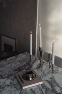 Kaboompics - Arabescato Marble Table - Metal Coffee Cup - Calendar - Candleholder