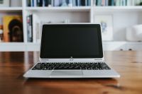 Silver laptop on a wooden table