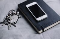 iPhone, Moleskin notebook, keys