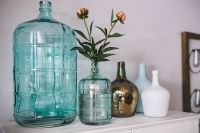 Jugs and flowers on a wardrobe