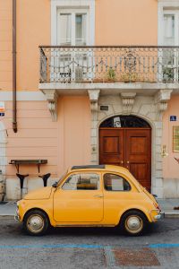 Classic Fiat 500 car parked on the street in the town of Trieste, Italy