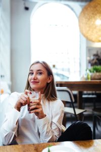 Kaboompics - Happy Beautiful woman having coffee at cafe