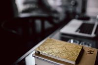 Close-up of golden journals