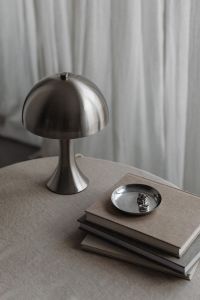 Kaboompics - Metal desk lamp - Silver Jewelry - Linen Tablecloth