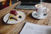 Macbook, iPhone, Magazine, Cheese Cake and Cup of Coffee