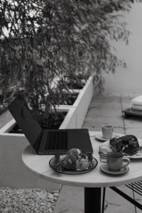 Kaboompics - Morning Meetings - Working in Coffeehouse with Coffee and Croissants