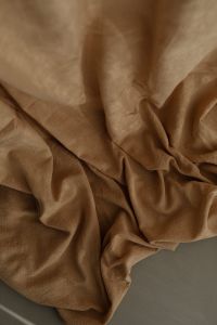 Kaboompics - Wrinkled curtain in beige or brown color