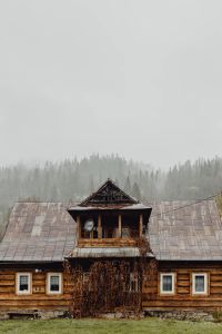 Old wooden houses in the mountains in autumn