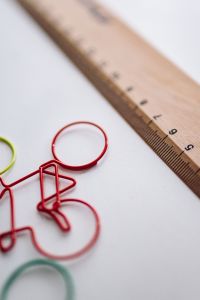 Kaboompics - Bicycle paper clips and a wooden ruler