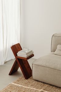 Glass of water - wooden stool - books