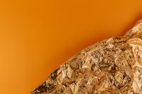 Kaboompics - Rose Gold Foil Texture & Orange Background