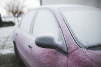 Kaboompics - Frost on a red car