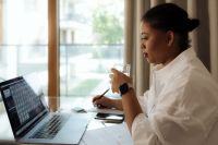 Kaboompics - Creative Black Woman Freelancer Working Remotely in a Modern Workspace