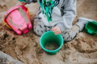Kaboompics - Toddler playing in the sand