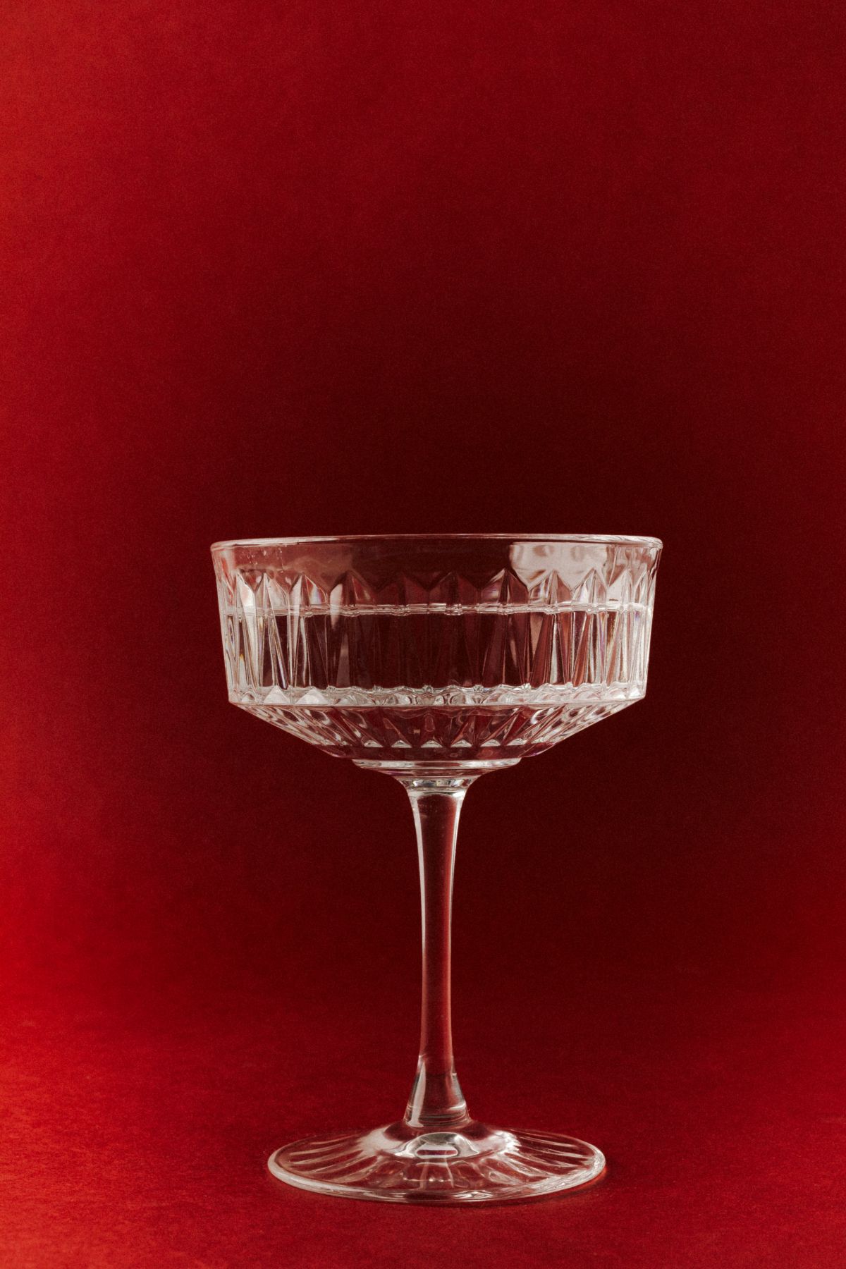 Sophisticated Glassware on Bold Red Backdrop