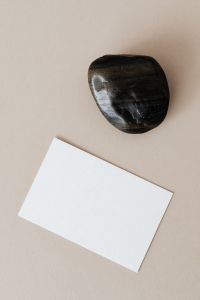 Kaboompics - Blank card & rock on beige background