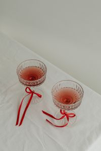 Kaboompics - Elegant Toast - Vintage Wine Glasses with Red Ribbon Accents