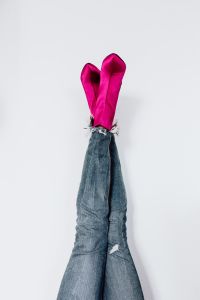 Kaboompics - A woman in pink boots and blue jeans