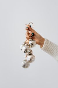 Kaboompics - Hand Holding Christmas Tree Baubles