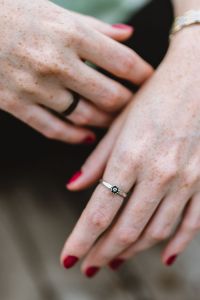 Detail of woman's hands and jewelry