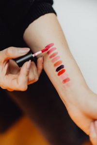 Lipstick swatches on woman hand