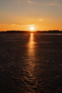 Kaboompics - Melting ice on the lake in winter at sunset