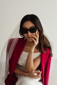 Kaboompics - Wedding - Bride - Portrait - Veil - Glass of Champagne - Sunglasses - Pink Jacket