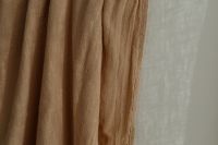 Wrinkled curtain in beige or brown color