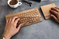Kaboompics - Young man typing on the wooden keyboard