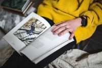 Kaboompics - Young woman reading a magazine in bed