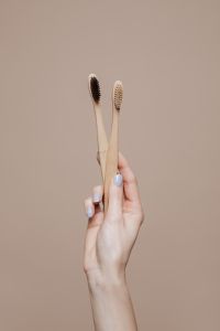 Kaboompics - Female dentist doctor holding a bamboo toothbrushes